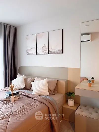 Elegant bedroom with modern decor, featuring a cozy bed, stylish artwork, and natural light for a serene ambiance.