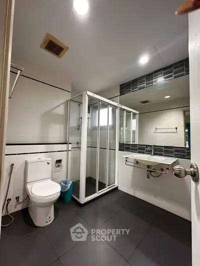 Modern bathroom with glass shower and sleek fixtures
