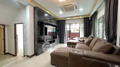 Spacious living room with modern decor and large sectional sofa
