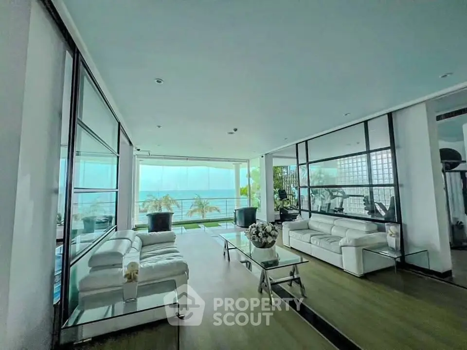 Luxurious living room with ocean view and modern white furniture