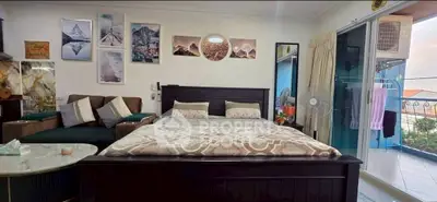 Spacious bedroom with balcony access and stylish decor