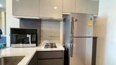 Modern kitchen with sleek cabinets and stainless steel appliances