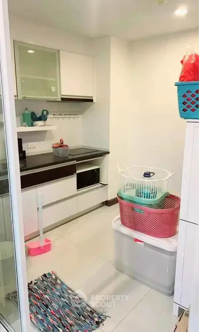 Compact kitchen with modern appliances and storage solutions