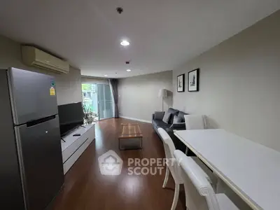 Modern living room with sleek furniture and wooden flooring