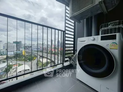 High-rise balcony with city view and modern washing machine, perfect for urban living.