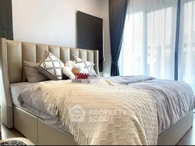 Luxurious bedroom with elegant decor and natural light