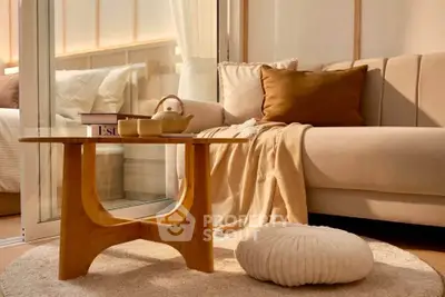 Cozy living room with modern beige sofa, wooden coffee table, and soft lighting for a warm ambiance.
