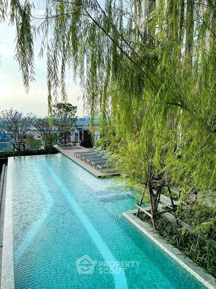 Stunning rooftop pool with lush greenery and panoramic views