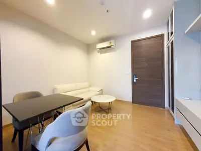 Modern living room with minimalist furniture and wooden flooring