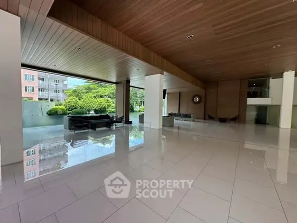 Spacious modern building entrance with sleek design and natural light.