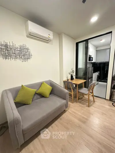 Modern living room with cozy sofa and dining area in stylish apartment