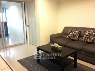 Modern living room with stylish sofa and coffee table in cozy apartment