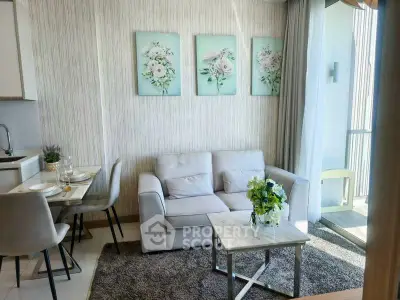 Charming living room with cozy sofa, elegant dining area, and balcony access in modern apartment.