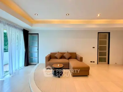 Spacious modern living room with stylish sofa and natural light