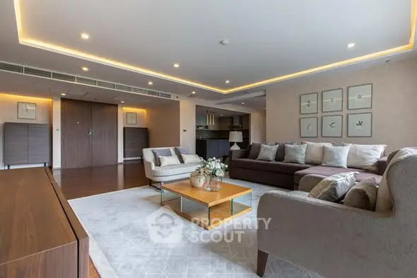 Spacious modern living room with elegant decor and ample seating in a luxury apartment.