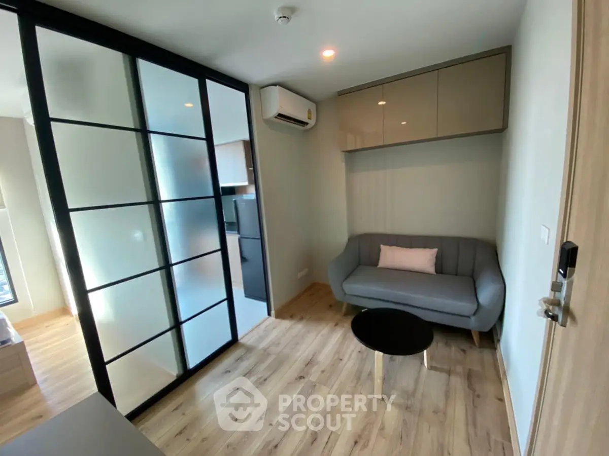 Modern living room with sleek design and sliding glass doors