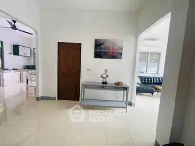 Spacious open layout with modern decor and kitchen view