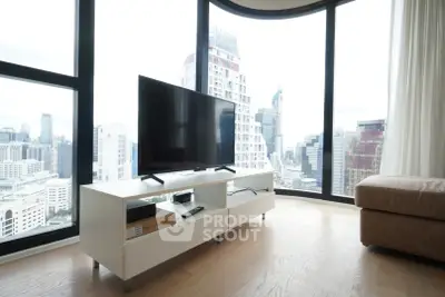 Modern living room with panoramic city view and sleek TV setup
