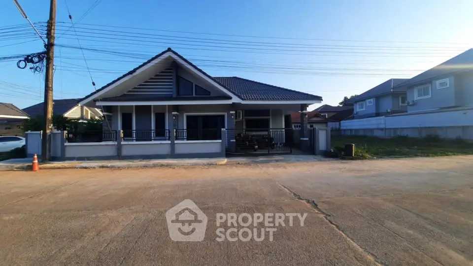 Charming single-story house with spacious front yard and modern design in a serene neighborhood.