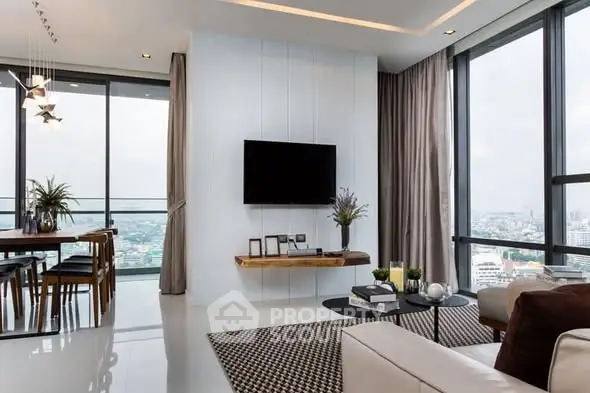 Luxurious modern living room with panoramic city views and elegant decor.