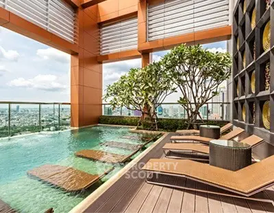 Luxurious rooftop pool with stunning city views and elegant lounge chairs.