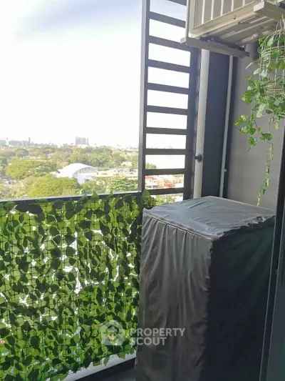 Charming balcony with lush greenery and scenic city view