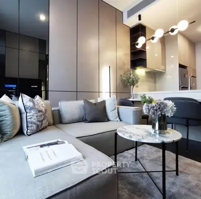 Modern living room with sleek design and open kitchen layout