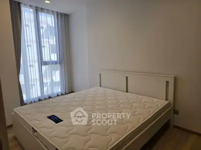 Cozy bedroom with natural light and modern decor