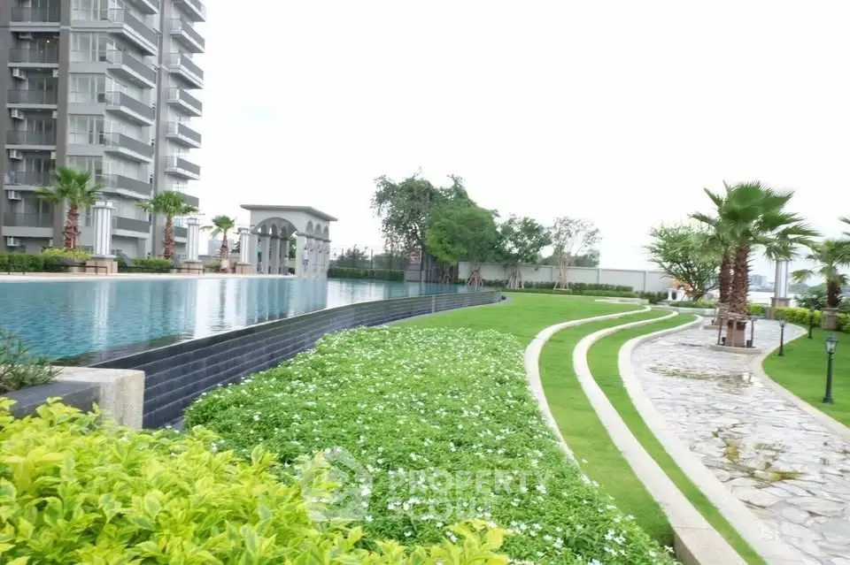 Luxurious apartment complex with stunning pool and landscaped garden