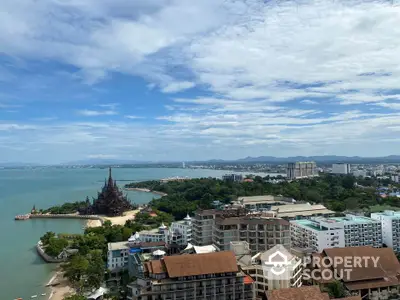 Stunning coastal view with cityscape and iconic landmark, perfect for real estate investment.