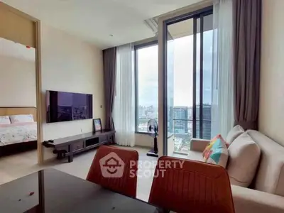 Modern living room with city view, stylish furniture, and large windows for natural light.