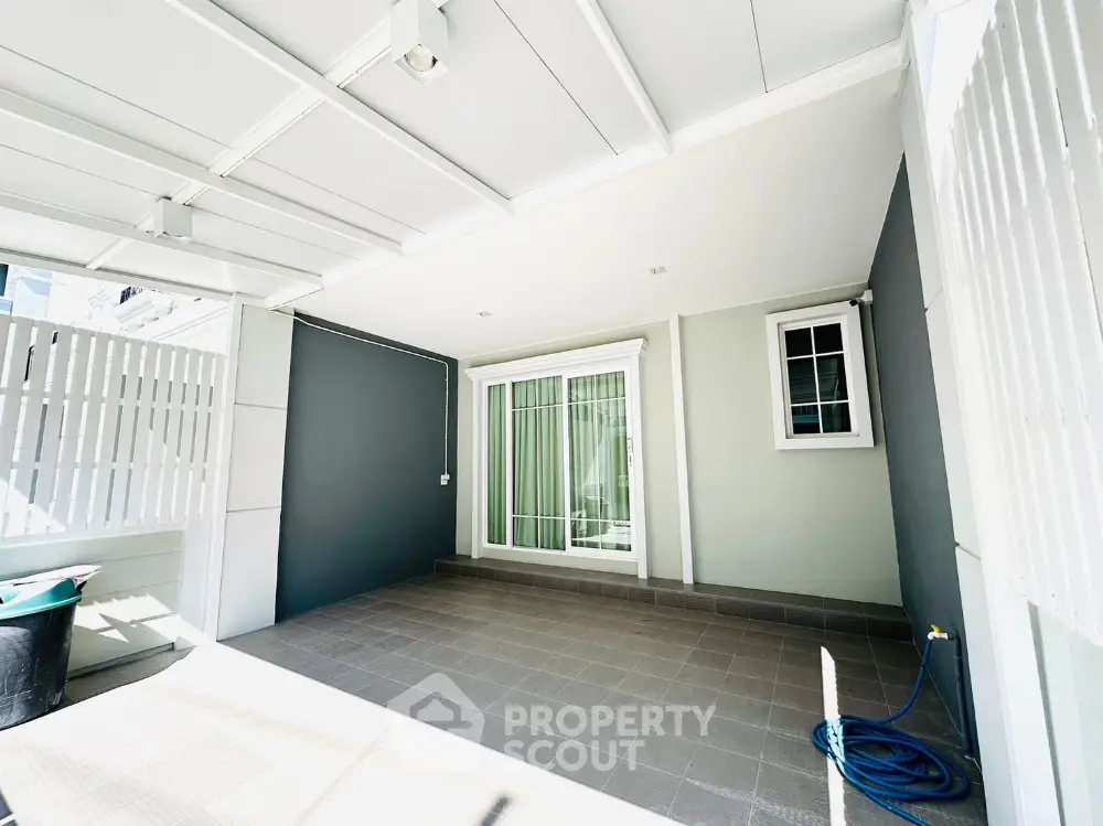 Spacious covered patio with modern design and ample natural light