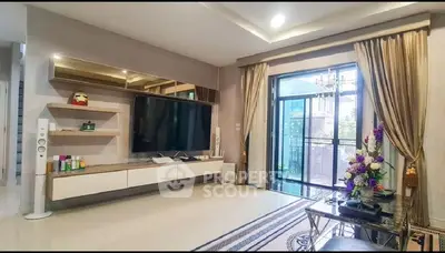 Spacious living room with modern decor and balcony access