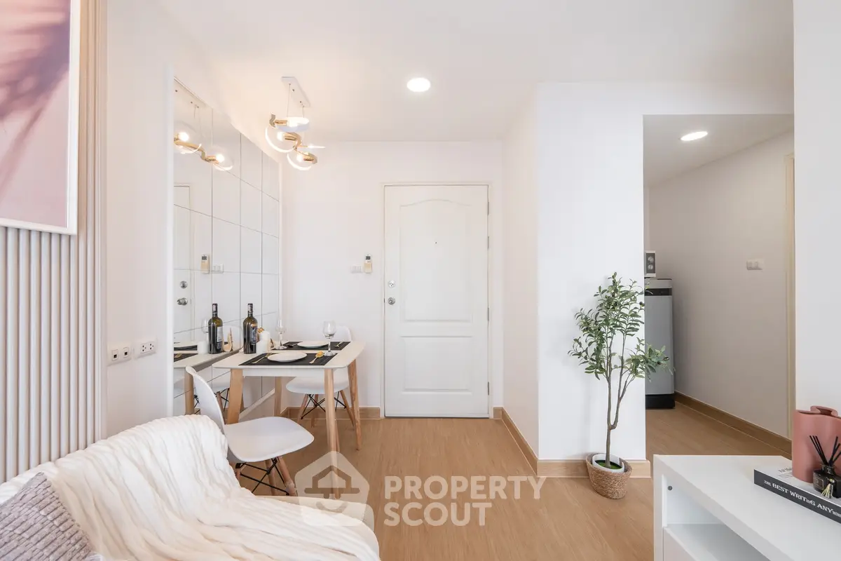 Modern living room with dining area, stylish decor, and natural light