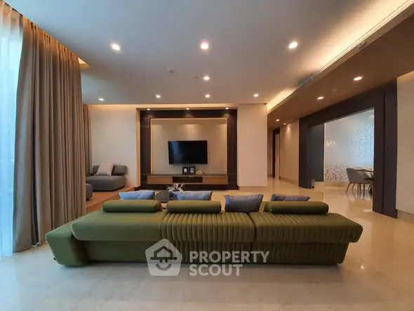 Luxurious living room with modern green sofa and elegant decor