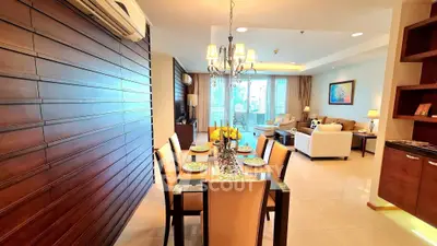 Luxurious open-plan living and dining area with elegant decor and ample natural light.