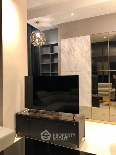 Luxurious modern living room with sleek TV stand and elegant lighting