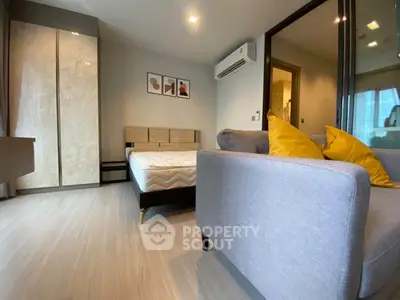 Modern bedroom with stylish decor and comfortable furnishings in a cozy apartment.