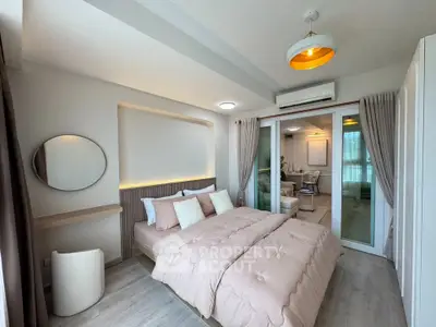 Modern bedroom with elegant decor and cozy ambiance, featuring a comfortable bed and stylish lighting.