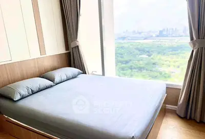 Spacious bedroom with stunning city view and large windows