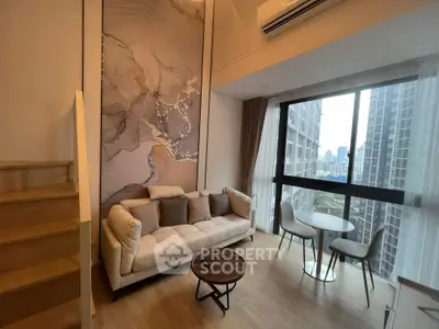 Modern living room with stunning city view, featuring elegant decor and cozy seating area.
