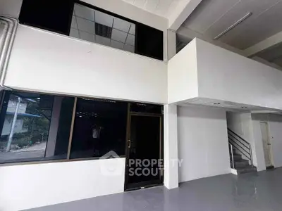 Spacious commercial property with mezzanine and large windows for lease