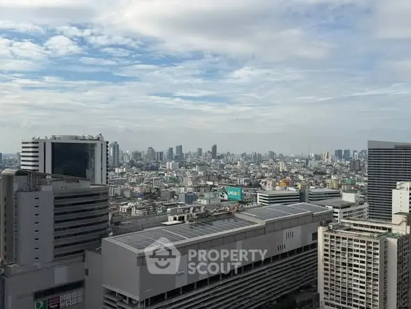 Stunning cityscape view showcasing a vibrant urban skyline under a clear blue sky.