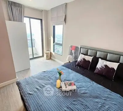 Modern bedroom with balcony access and stylish decor