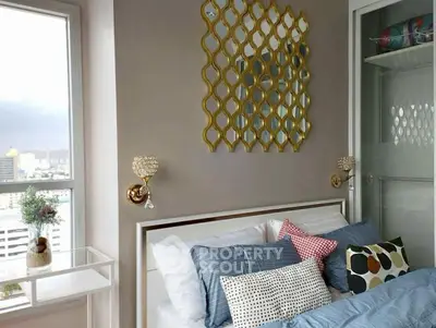 Stylish bedroom with modern decor and city view, featuring elegant wall mirror and cozy bedding.