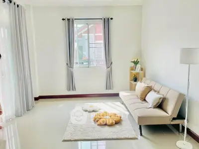 Bright and airy living room with modern decor and cozy seating area.