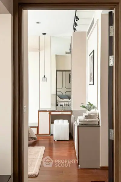 Modern bedroom with wooden flooring and stylish decor