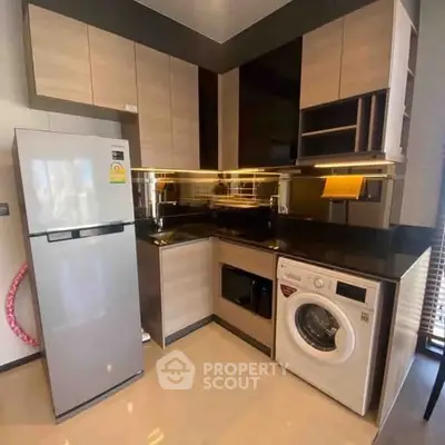 Modern kitchen with sleek appliances and stylish cabinetry