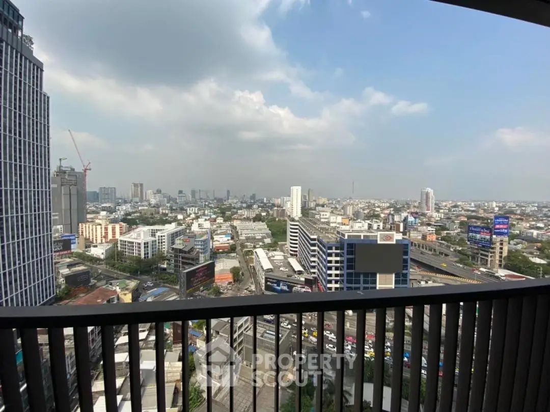 Stunning cityscape view from a high-rise balcony, showcasing urban skyline and vibrant city life.