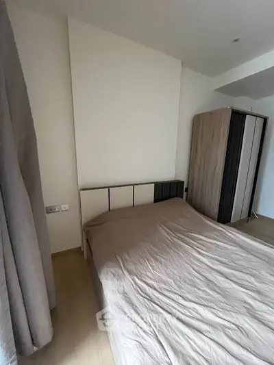 Cozy bedroom with modern wardrobe and neutral decor